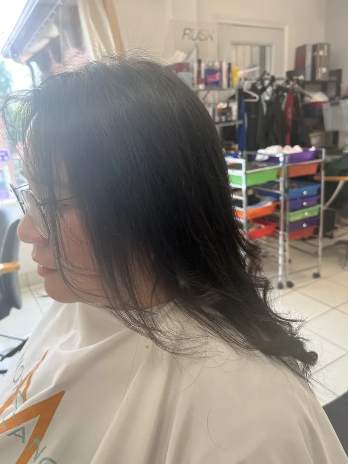Long layered dark hair after a cut