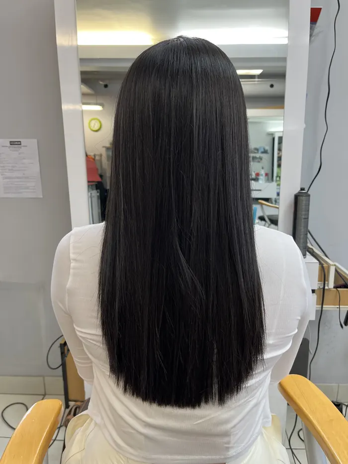 Long, sleek straight dark hair after a salon treatment