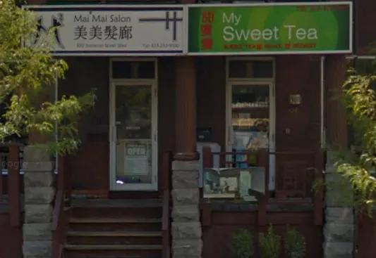 Mai Mai Salon storefront with its sign beside My Sweet Tea